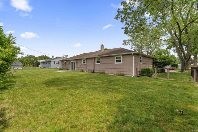 115 N Varsity Dr, South Bend, IN 46615 - back of property featuring a chimney
