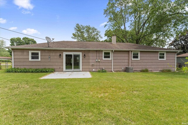 115 N Varsity Dr, South Bend, IN 46615 - back of house with a patio, a chimney, and a shingled roof