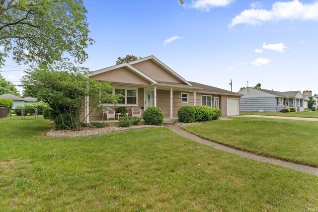 115 N Varsity Dr, South Bend, IN 46615 - ranch-style house featuring a porch, an attached garage, and driveway