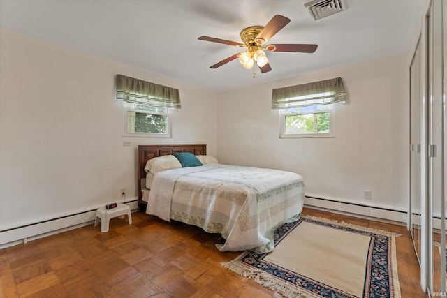 115 N Varsity Dr, South Bend, IN 46615 - bedroom with a baseboard heating unit and a ceiling fan