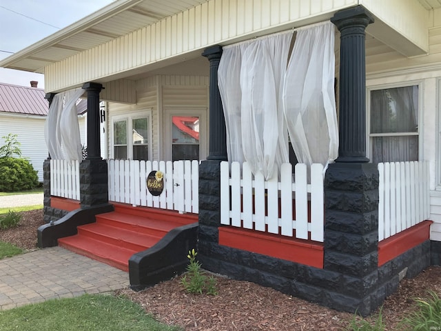 20 N Meridian St, Redkey, IN 47373 - doorway to property featuring covered porch