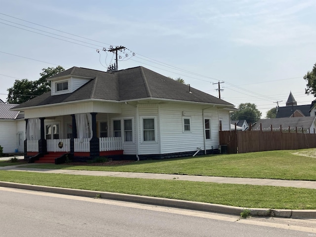 20 N Meridian St, Redkey, IN 47373 - view of front facade featuring covered porch and roof with shingles