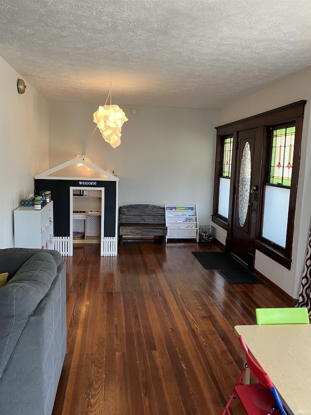 20 N Meridian St, Redkey, IN 47373 - entryway with a chandelier, a textured ceiling, and hardwood / wood-style flooring