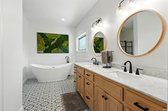 12733 Covington Manor Farms Rd, Fort Wayne, IN 46814 - full bath featuring double vanity, a freestanding tub, recessed lighting, and tile patterned floors