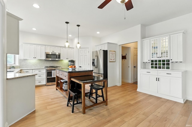 12733 Covington Manor Farms Rd, Fort Wayne, IN 46814 - kitchen featuring stainless steel appliances, light wood finished floors, ceiling fan, white cabinets, and recessed lighting