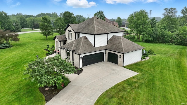 12733 Covington Manor Farms Rd, Fort Wayne, IN 46814 - view of side of home with an attached garage, roof with shingles, a yard, and driveway