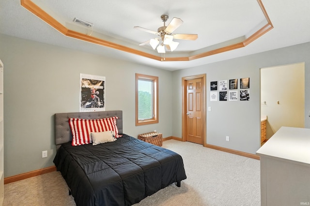 12733 Covington Manor Farms Rd, Fort Wayne, IN 46814 - bedroom featuring a raised ceiling, light carpet, and a ceiling fan