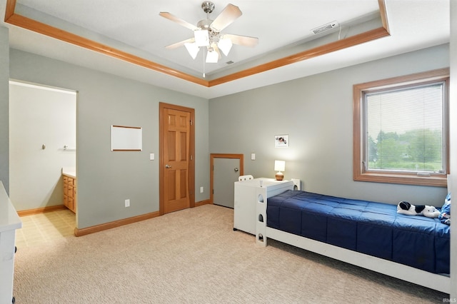 12733 Covington Manor Farms Rd, Fort Wayne, IN 46814 - bedroom featuring a raised ceiling, light colored carpet, ensuite bathroom, and ceiling fan