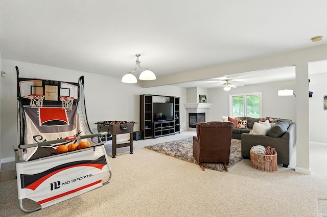 12733 Covington Manor Farms Rd, Fort Wayne, IN 46814 - living room with carpet floors, a ceiling fan, and a glass covered fireplace
