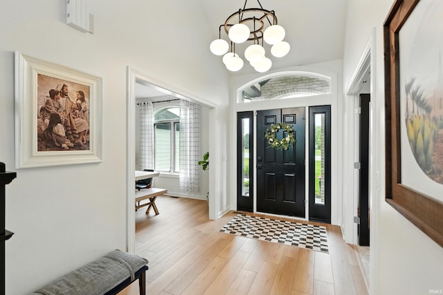 12733 Covington Manor Farms Rd, Fort Wayne, IN 46814 - foyer entrance with light wood-style flooring and a chandelier