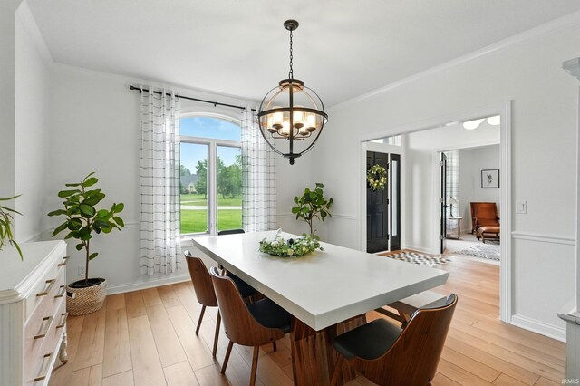 12733 Covington Manor Farms Rd, Fort Wayne, IN 46814 - dining room featuring a chandelier, light wood finished floors, and crown molding