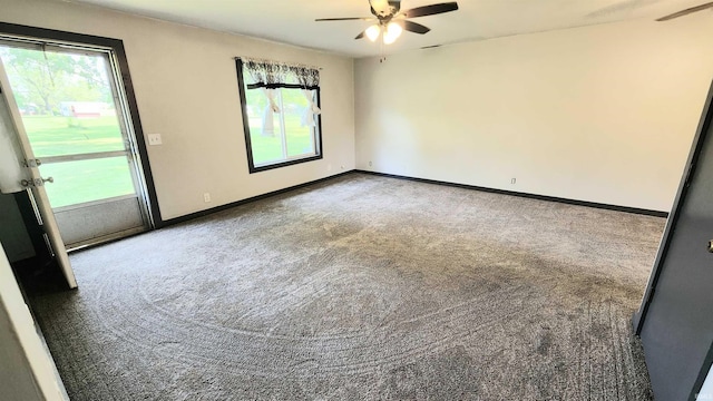 406 James St, Butler, IN 46721 - carpeted spare room with a ceiling fan and plenty of natural light