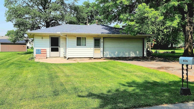 406 James St, Butler, IN 46721 - view of front of house featuring an attached garage, a front yard, driveway, and roof with shingles