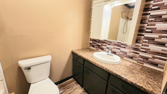 406 James St, Butler, IN 46721 - bathroom featuring decorative backsplash, vanity, and a shower