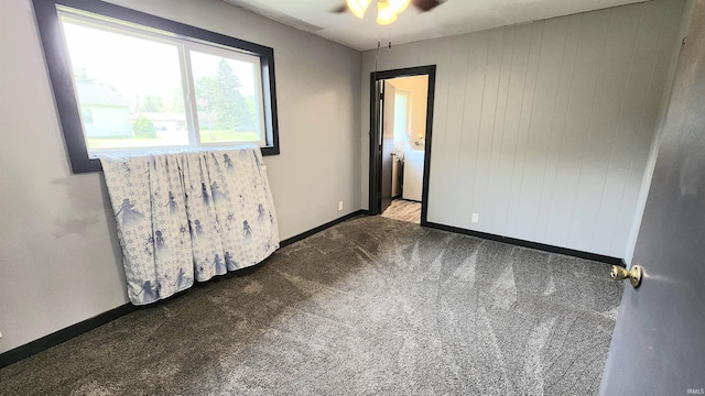 406 James St, Butler, IN 46721 - carpeted empty room with ceiling fan and washer / clothes dryer