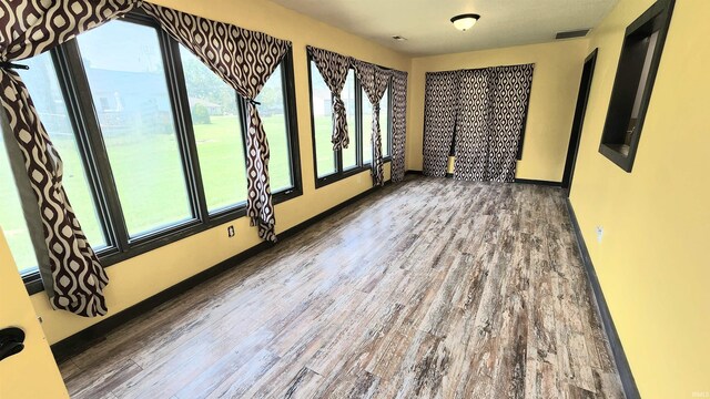 406 James St, Butler, IN 46721 - spare room with wood finished floors