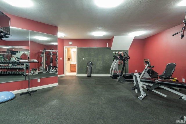 3104 E Chase Ln, Bloomington, IN 47401 - workout area featuring baseboards and a textured ceiling