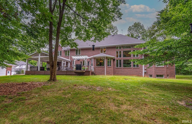 3104 E Chase Ln, Bloomington, IN 47401 - back of property with a pergola, a yard, and brick siding