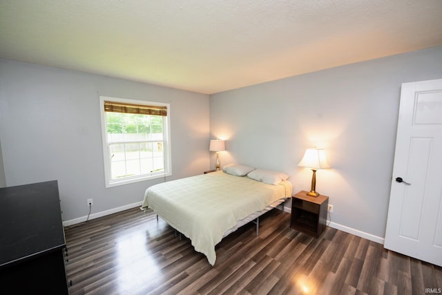 3030 Jamestown Cir, Lafayette, IN 47909 - bedroom with dark wood-style flooring and baseboards