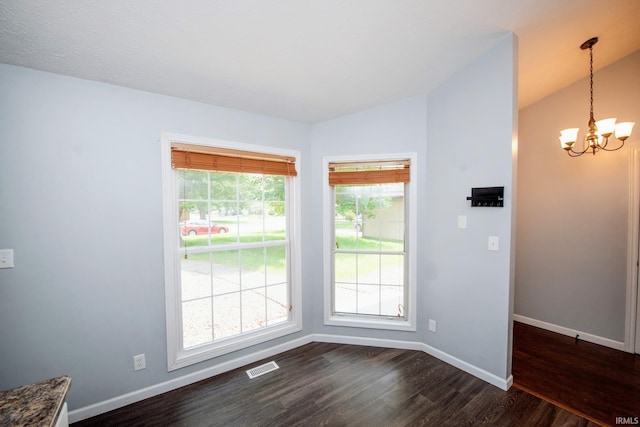 3030 Jamestown Cir, Lafayette, IN 47909 - empty room featuring dark wood-type flooring, a chandelier, and vaulted ceiling