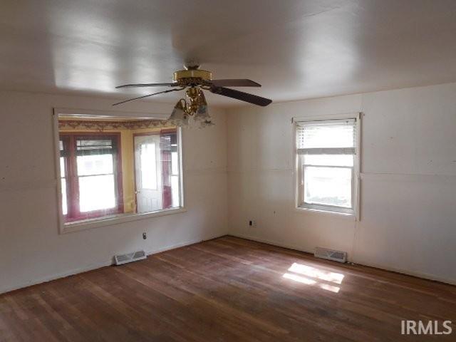 408 E Water St, Centerville, IN 47330 - spare room featuring plenty of natural light, wood finished floors, and a ceiling fan