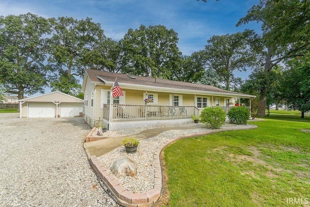 3015 N Washington St, Kokomo, IN 46901 - single story home with covered porch, an outdoor structure, a garage, and a front lawn