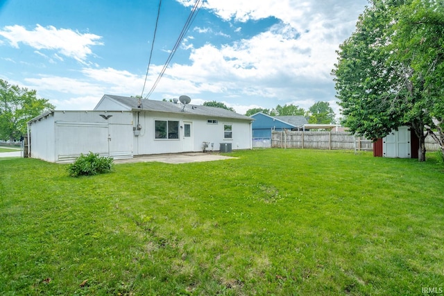 1004 Shenandoah Dr, Lafayette, IN 47905 - back of property with a patio area and a shed