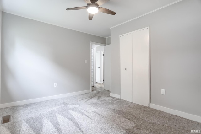 1004 Shenandoah Dr, Lafayette, IN 47905 - unfurnished bedroom featuring carpet, a closet, ornamental molding, and ceiling fan