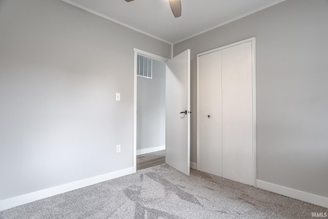 1004 Shenandoah Dr, Lafayette, IN 47905 - unfurnished bedroom featuring carpet flooring, a closet, ornamental molding, and a ceiling fan