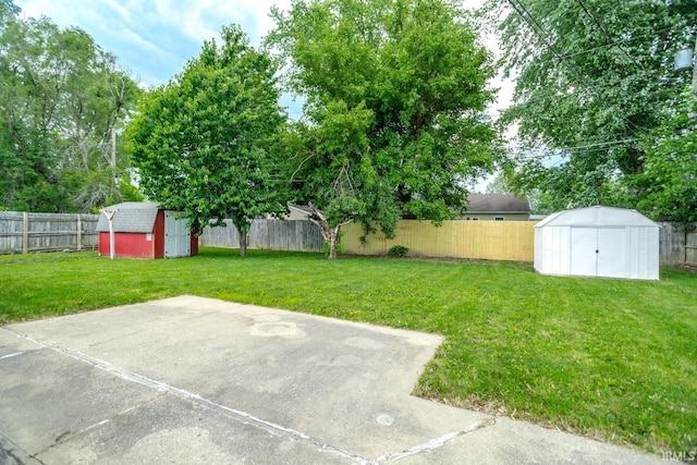 1004 Shenandoah Dr, Lafayette, IN 47905 - fenced backyard featuring a storage unit and a patio area