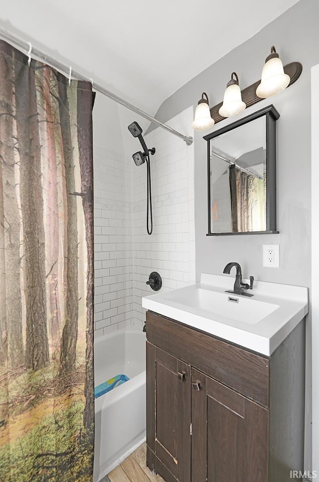 19252 Cleveland Rd, South Bend, IN 46637 - bathroom featuring vanity, shower / tub combo, and wood finished floors
