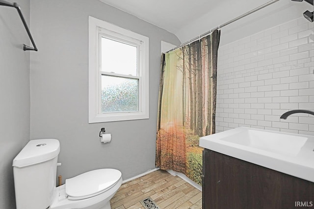 19252 Cleveland Rd, South Bend, IN 46637 - full bath with wood finished floors, vanity, and curtained shower