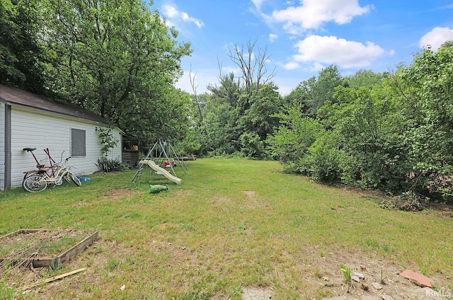 19252 Cleveland Rd, South Bend, IN 46637 - view of green lawn with a garden