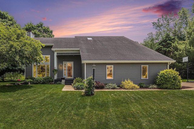 51790 Sulkey Ct, Granger, IN 46530 - view of front of property featuring a front yard, roof with shingles, and a chimney