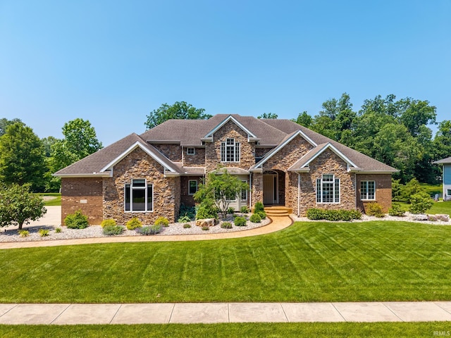 3328 Tarrant Springs Trl, Fort Wayne, IN 46804 - craftsman house featuring a front yard, stone siding, and a shingled roof