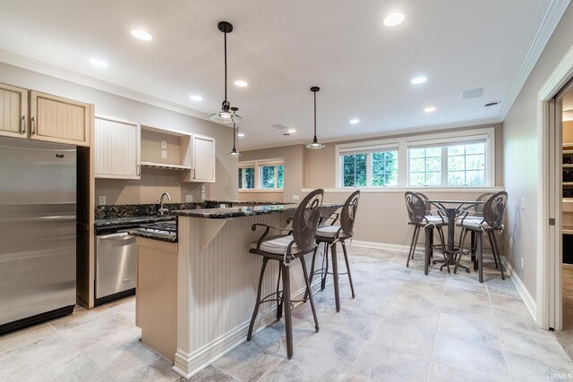 3328 Tarrant Springs Trl, Fort Wayne, IN 46804 - kitchen featuring appliances with stainless steel finishes, ornamental molding, recessed lighting, a kitchen breakfast bar, and a kitchen island