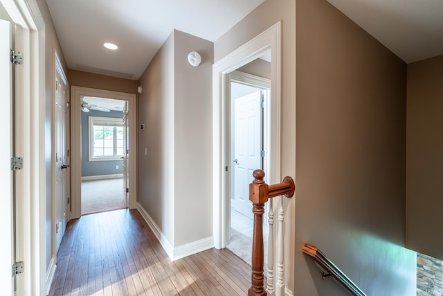 3328 Tarrant Springs Trl, Fort Wayne, IN 46804 - hallway with an upstairs landing, light wood-type flooring, and recessed lighting