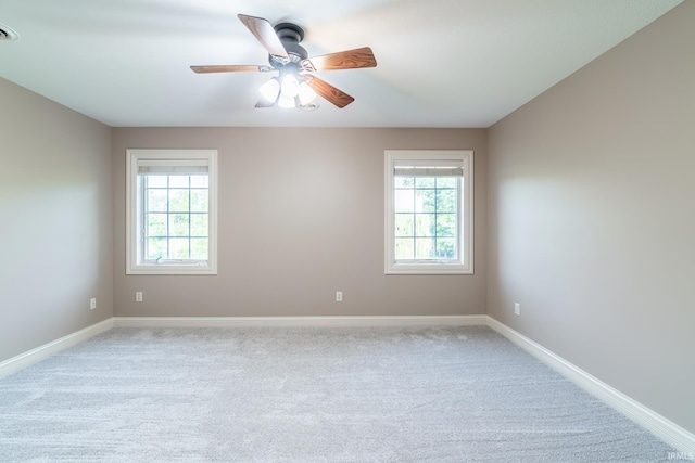 3328 Tarrant Springs Trl, Fort Wayne, IN 46804 - empty room featuring plenty of natural light, a ceiling fan, and light colored carpet