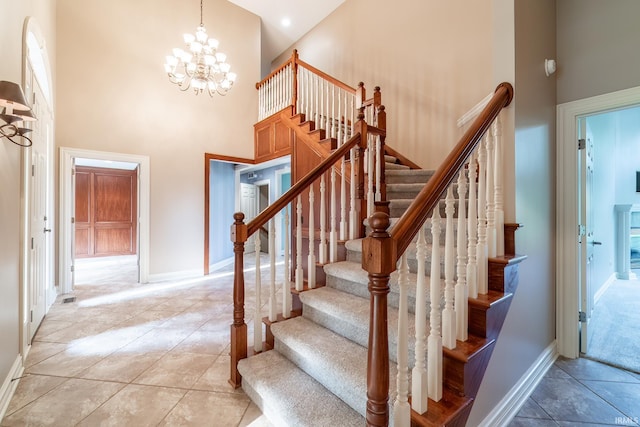 3328 Tarrant Springs Trl, Fort Wayne, IN 46804 - stairs with a towering ceiling and a chandelier