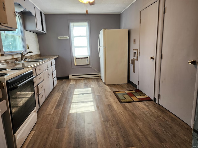317 E Main St, Berne, IN 46711 - kitchen featuring freestanding refrigerator, electric stove, a baseboard heating unit, light wood-style flooring, and cooling unit