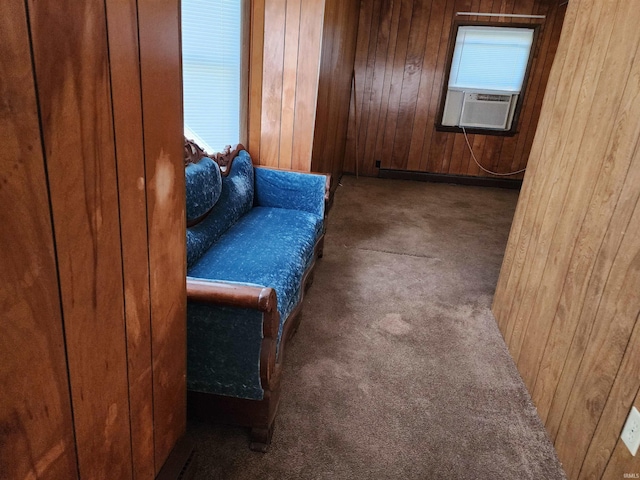 317 E Main St, Berne, IN 46711 - living area with carpet flooring, wooden walls, and cooling unit