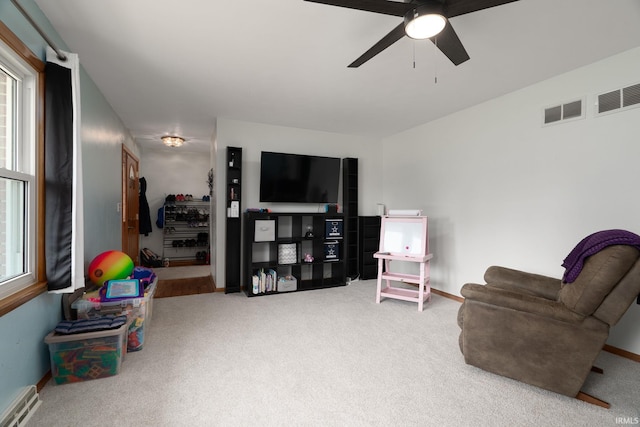3506 Mark Ct, Lafayette, IN 47905 - living area with carpet flooring, ceiling fan, and a baseboard radiator