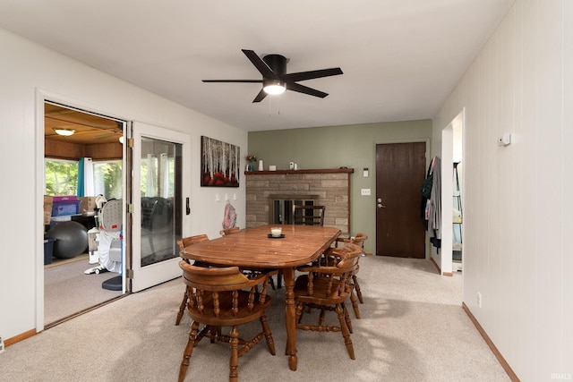 3506 Mark Ct, Lafayette, IN 47905 - dining area featuring ceiling fan, light carpet, and a fireplace