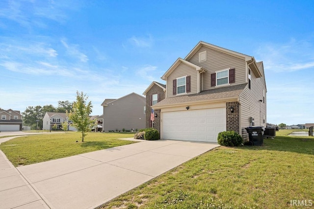 938 Sand Walk Ln, Kokomo, IN 46902 - view of front facade featuring an attached garage, brick siding, driveway, and a front lawn