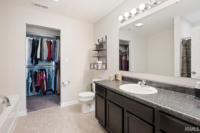 938 Sand Walk Ln, Kokomo, IN 46902 - full bathroom featuring vanity, a walk in closet, and a bath