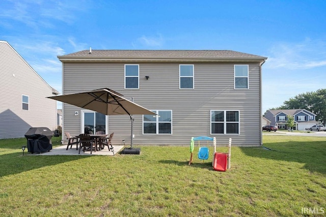 938 Sand Walk Ln, Kokomo, IN 46902 - back of house featuring a patio area and a lawn