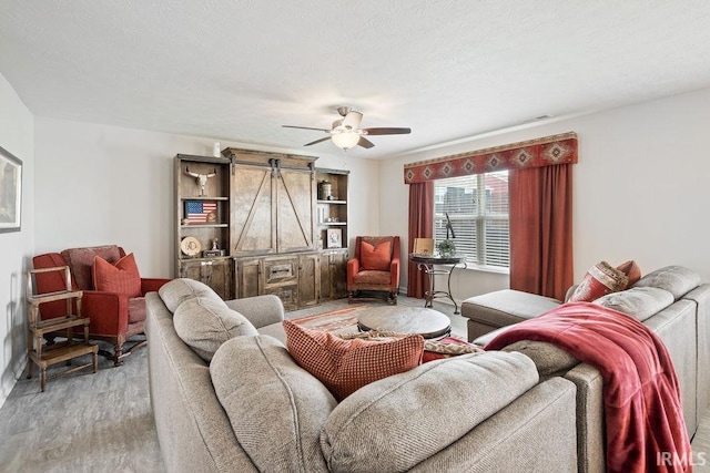 938 Sand Walk Ln, Kokomo, IN 46902 - living area featuring a barn door, wood finished floors, and ceiling fan