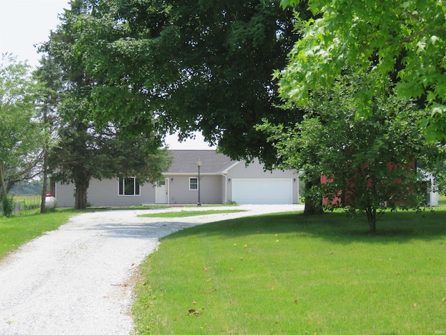 10239 State Road 26 E, Lafayette, IN 47905 - view of front facade with driveway, a front yard, and a garage
