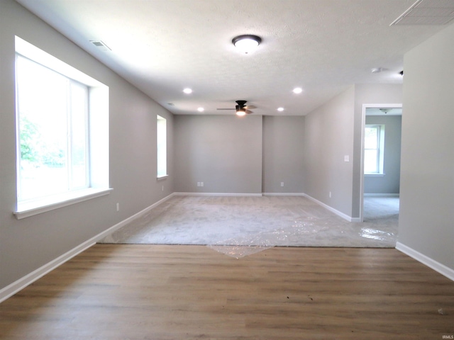 10239 State Road 26 E, Lafayette, IN 47905 - empty room featuring wood finished floors, ceiling fan, and recessed lighting