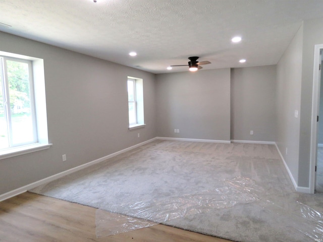 10239 State Road 26 E, Lafayette, IN 47905 - empty room with healthy amount of natural light, a ceiling fan, recessed lighting, and carpet floors